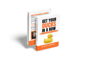 Book cover: 'Get Your Ducks in a Row' by Michon Henegar; a motivational guide to organization, focus, and peak performance.